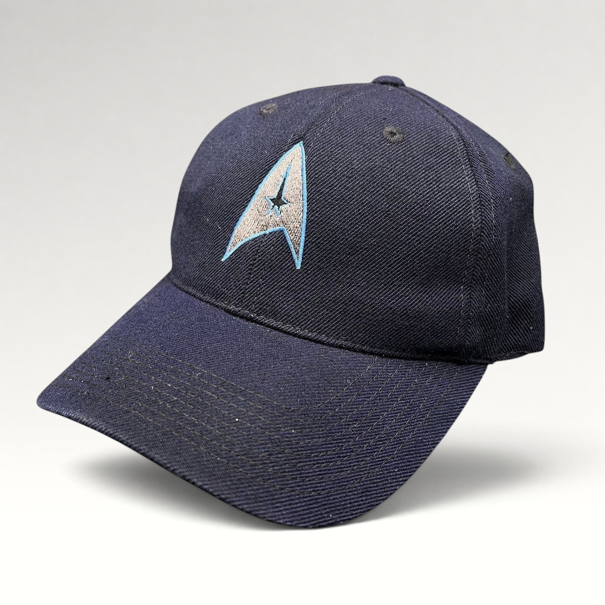 Raree Finds navy blue cotton twill Star Trek 2009 crew hat with embroidered Starfleet delta insignia on the front