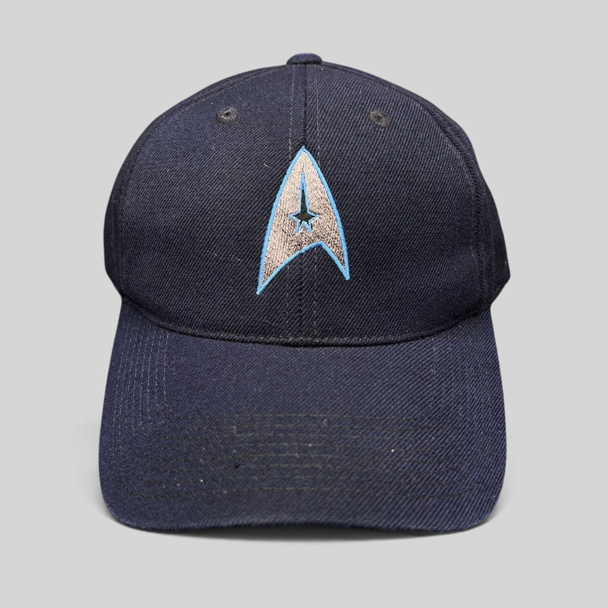 Raree Finds navy blue cotton twill Star Trek 2009 film crew strapback hat with embroidered Starfleet delta insignia