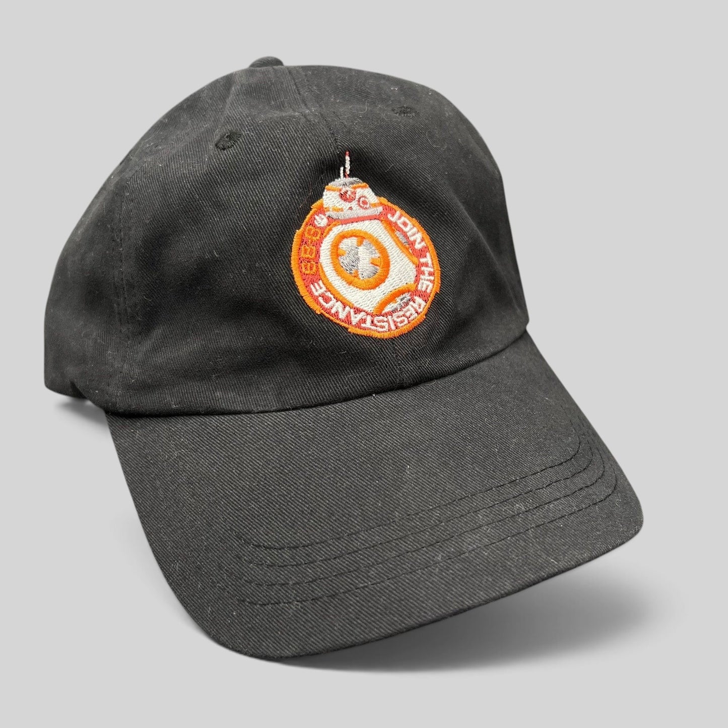 Raree Finds black cotton Star Wars Force Awakens BB-8 cast and crew strapback hat with embroidered Resistance emblem.