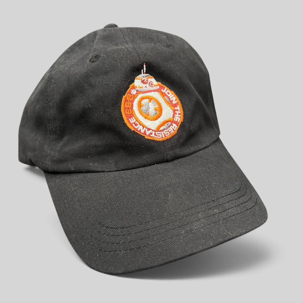 Raree Finds black cotton Star Wars Force Awakens BB-8 cast and crew strapback hat with embroidered Resistance emblem.