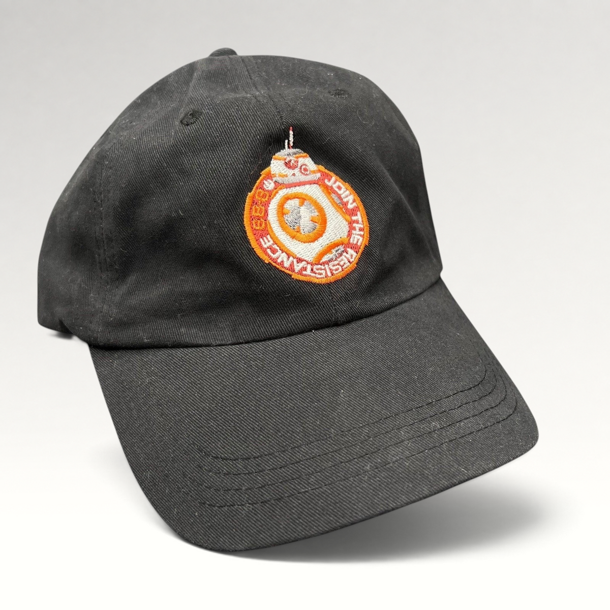 Raree Finds black cotton Star Wars Force Awakens BB-8 cast and crew strapback hat with embroidered Resistance emblem.