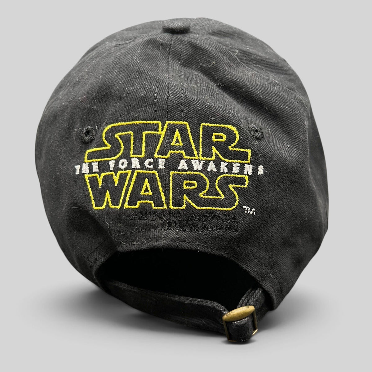 Raree Finds Star Wars The Force Awakens black cotton strapback hat with yellow embroidered logo and brass buckle