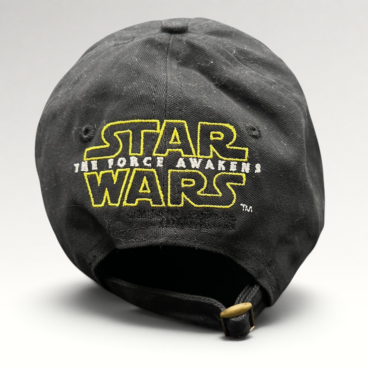 Raree Finds Star Wars The Force Awakens black cotton strapback hat with yellow embroidered logo and brass buckle