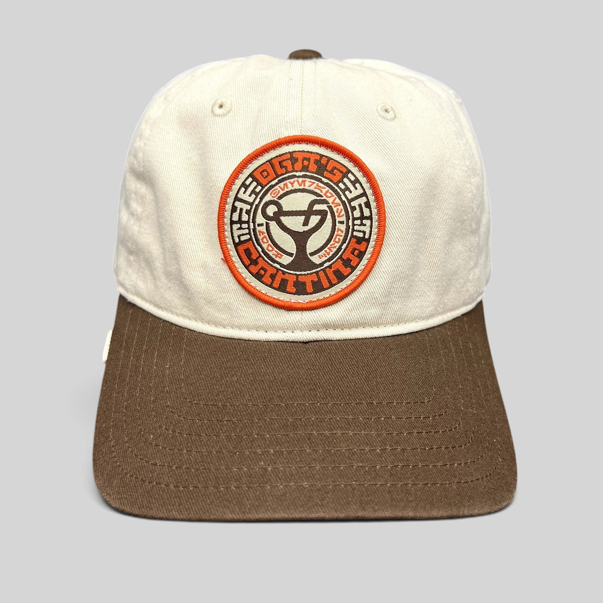 Raree Finds Star Wars Galactic Sentients dad hat with a cream crown, brown brim, and circular embroidered emblem.