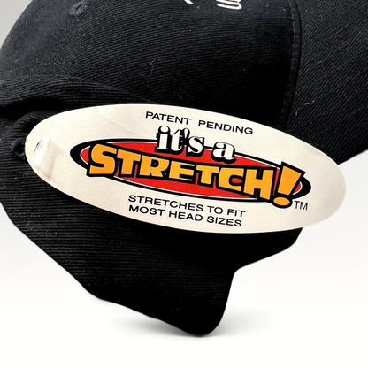 Raree Finds black stretch-fit hat featuring an It's a Stretch! tag on the brim from the 2004 Aspen Wintersköl festival.