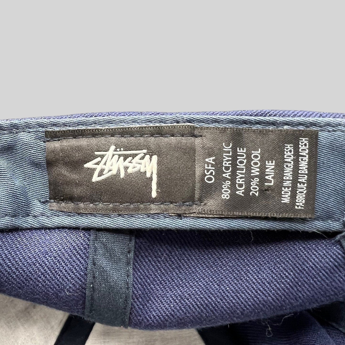 Raree Finds Stussy navy strapback hat interior label showing acrylic and wool blend material and brand logo
