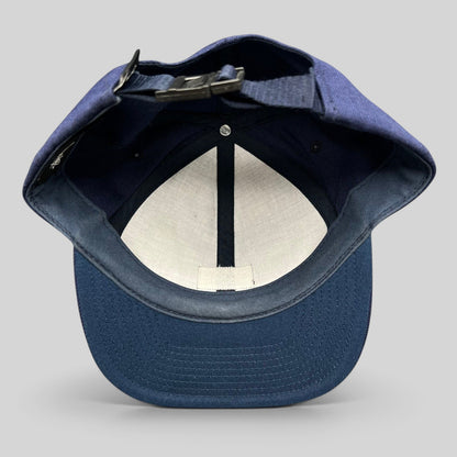 Raree Finds navy Stussy strapback hat interior view showing adjustable strap closure and structured crown construction