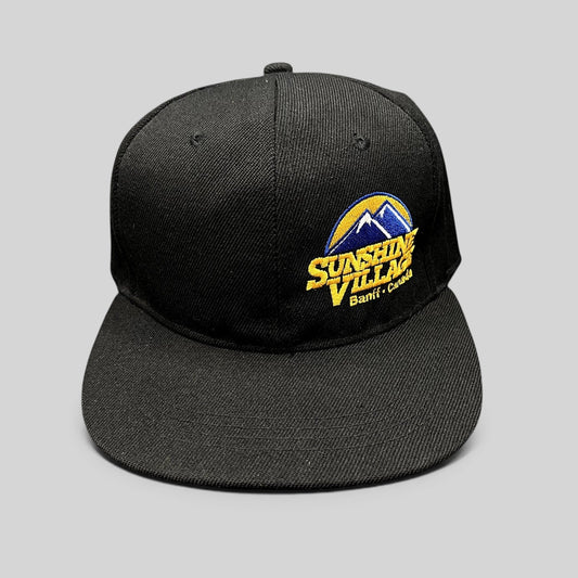 Raree Finds black structured snapback hat with embroidered Sunshine Village Banff Canada mountain logo and flat brim