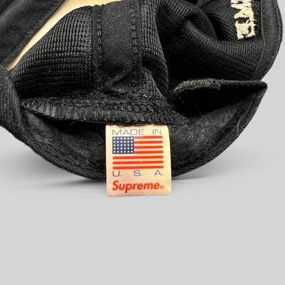 Raree Finds vintage Supreme black mesh snapback hat interior tag showing Made in USA label