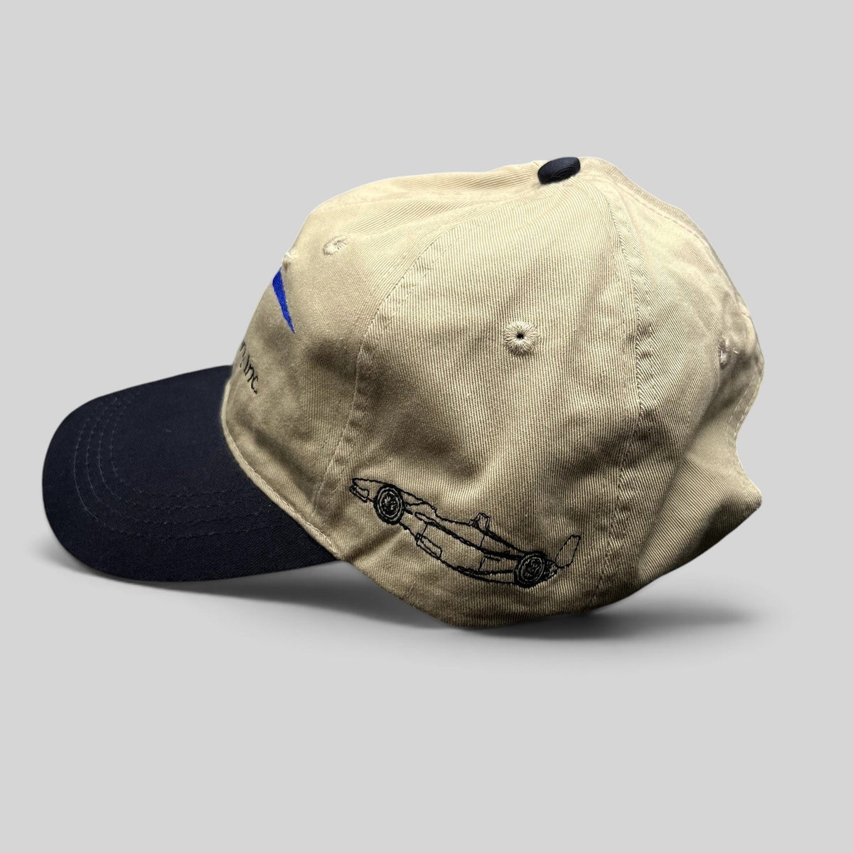 Raree Finds vintage Swift Engineering Inc two-tone khaki and navy cotton strapback hat with Indy car embroidery.