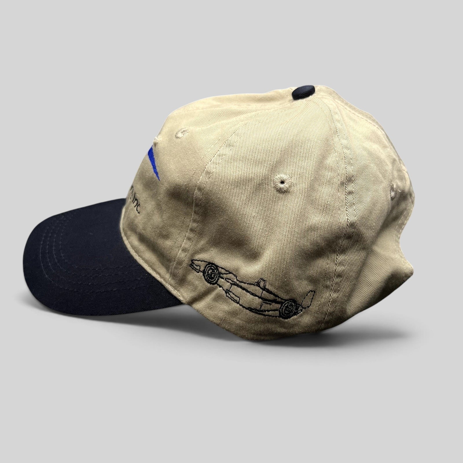 Raree Finds vintage Swift Engineering Inc two-tone khaki and navy cotton strapback hat with Indy car embroidery.