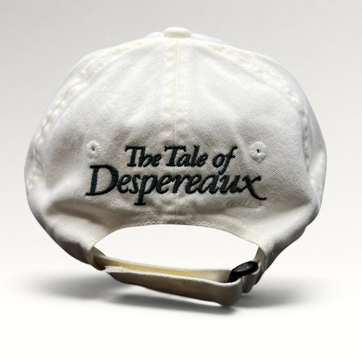 Raree Finds white cotton strapback hat featuring The Tale of Despereaux movie title embroidery on the back