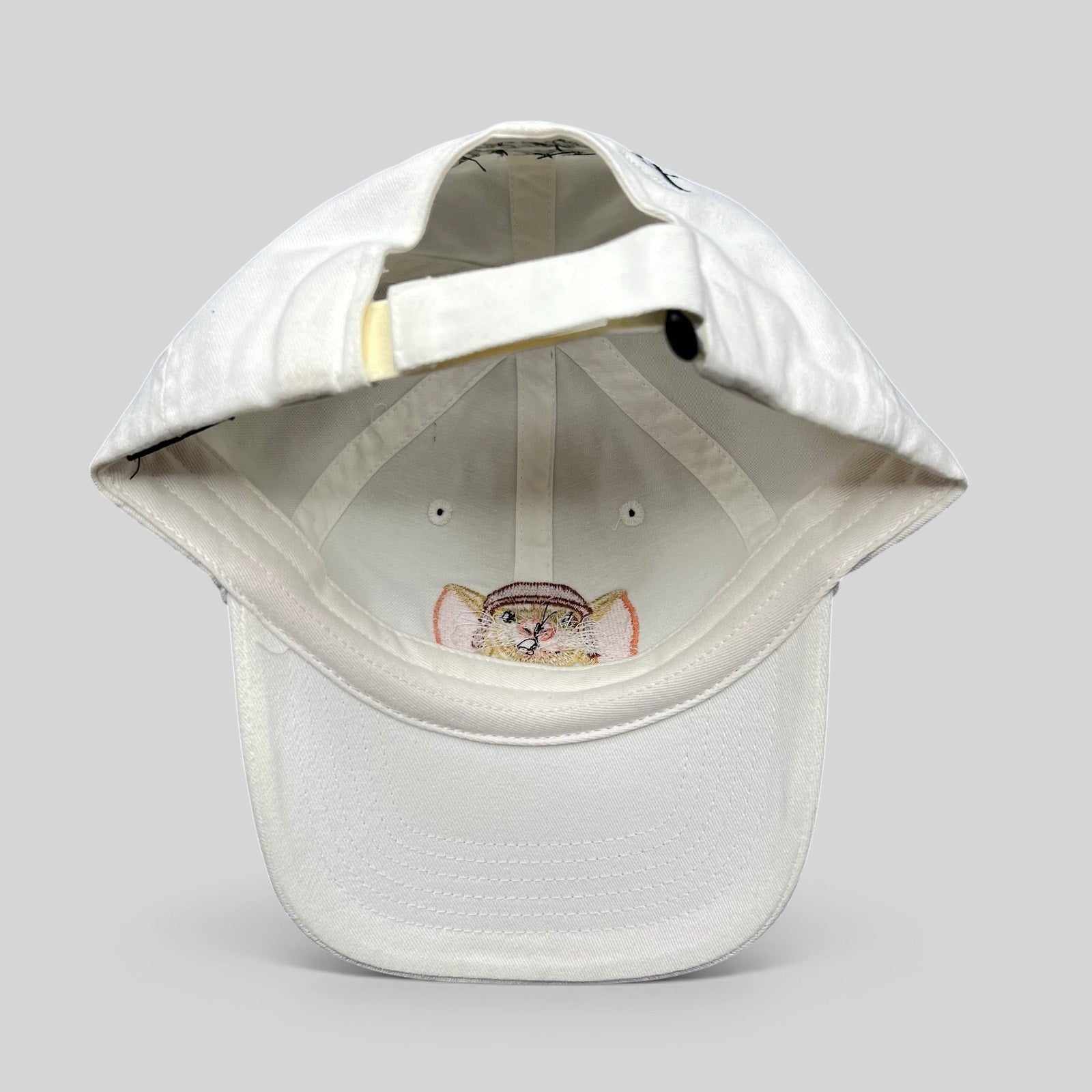 Raree Finds white cotton youth strapback hat featuring an embroidered Tale of Despereaux mouse character graphic