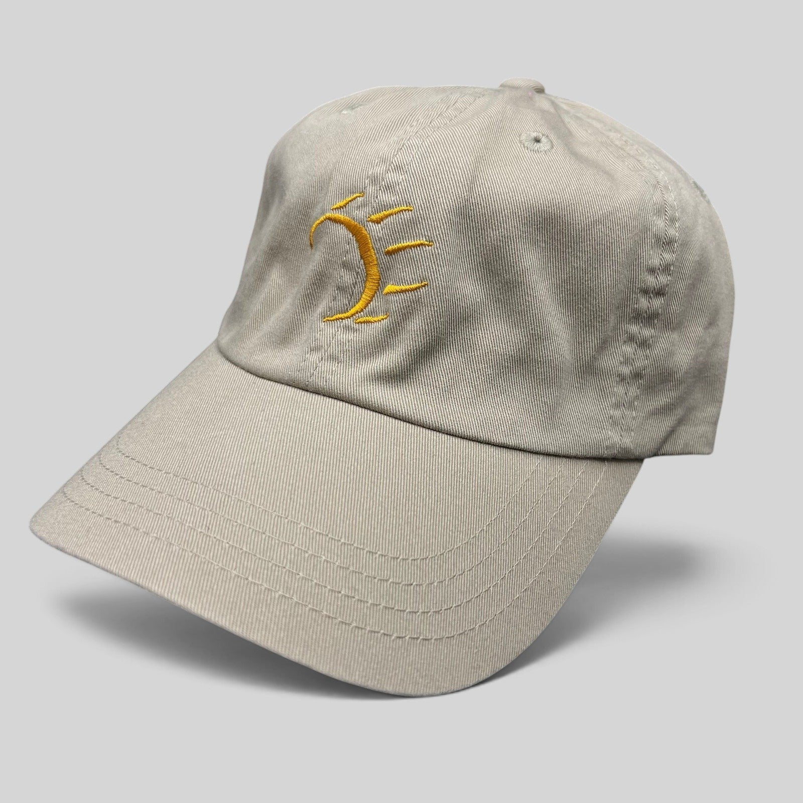 Raree Finds vintage tan cotton strapback hat with minimalist gold embroidered dancing bear graphic