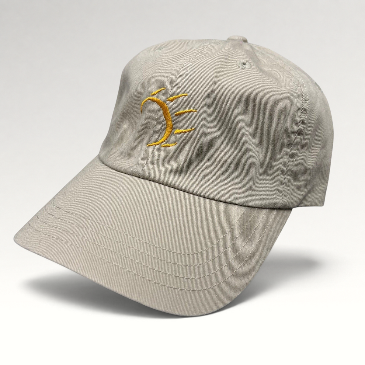 Raree Finds vintage tan cotton strapback hat with minimalist gold embroidered dancing bear graphic