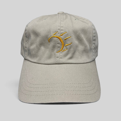 Raree Finds vintage tan cotton strapback hat with a minimalist gold embroidered dancing bear graphic on the front.