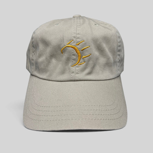 Raree Finds vintage tan cotton strapback hat with a minimalist gold embroidered dancing bear graphic on the front.