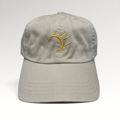 Raree Finds vintage tan cotton strapback hat with a minimalist gold embroidered dancing bear graphic on the front.
