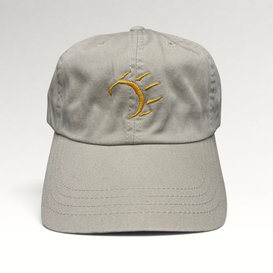 Raree Finds vintage tan cotton strapback hat with a minimalist gold embroidered dancing bear graphic on the front.