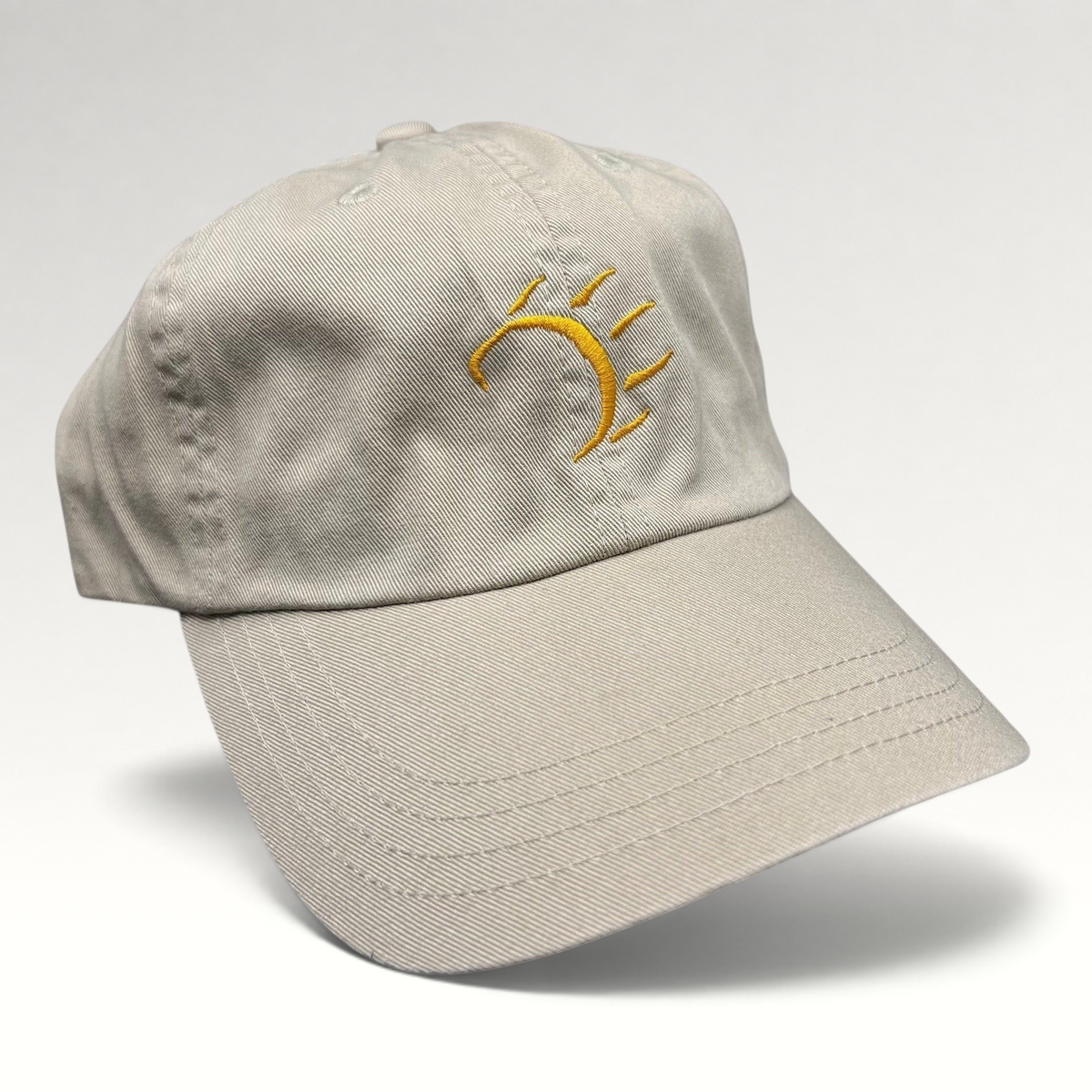 Raree Finds vintage tan cotton strapback hat with a minimalist gold embroidered dancing bear graphic