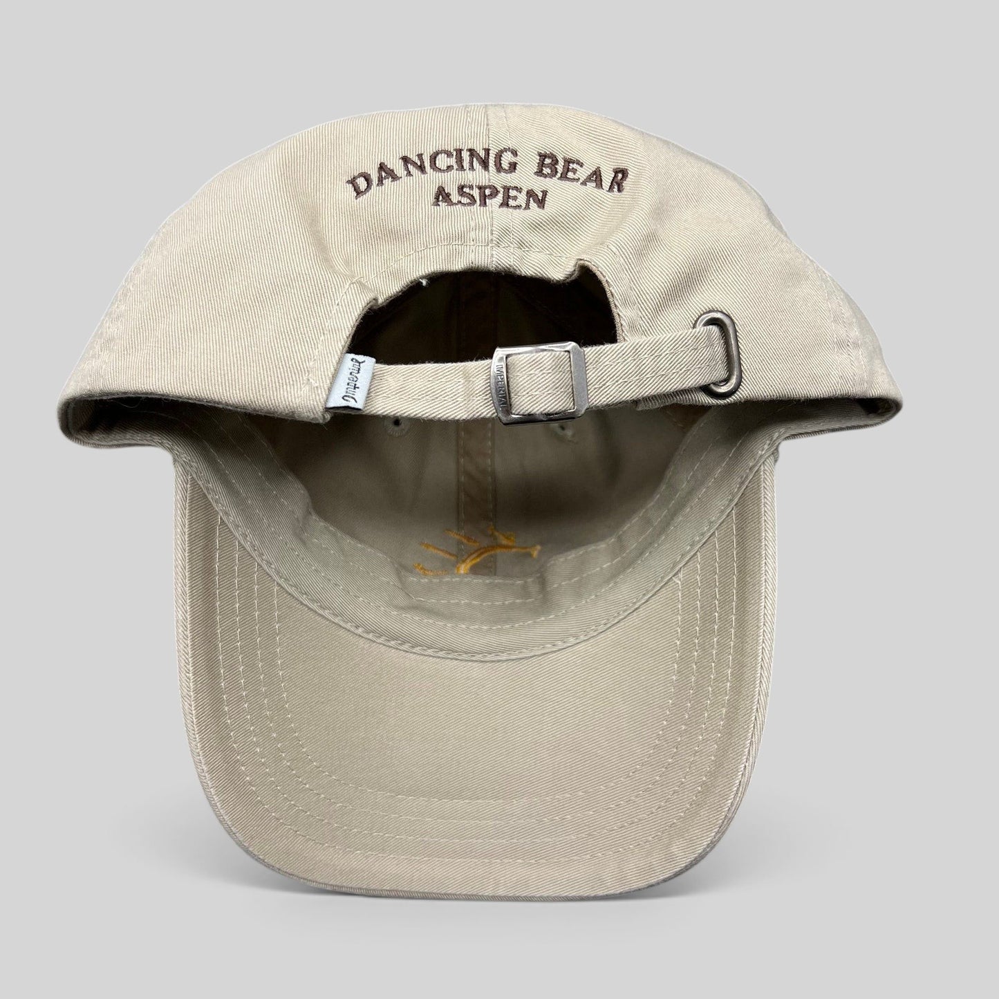 Raree Finds vintage tan cotton strapback hat with Dancing Bear Aspen embroidery on the back and adjustable buckle