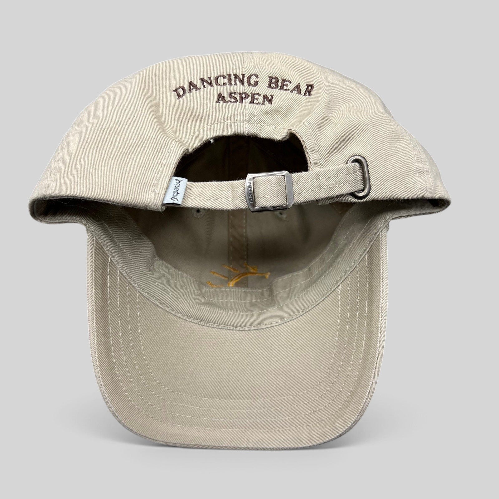 Raree Finds vintage tan cotton strapback hat with Dancing Bear Aspen embroidery on the back and adjustable buckle