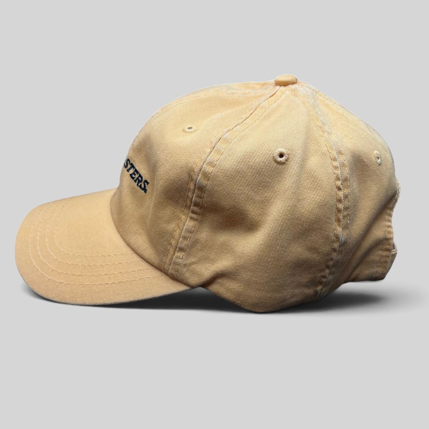 Raree Finds vintage tan cotton dad cap with Trashmasters embroidered text in a side profile view