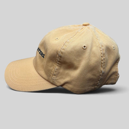 Raree Finds vintage tan cotton dad cap with Trashmasters embroidered text in a side profile view