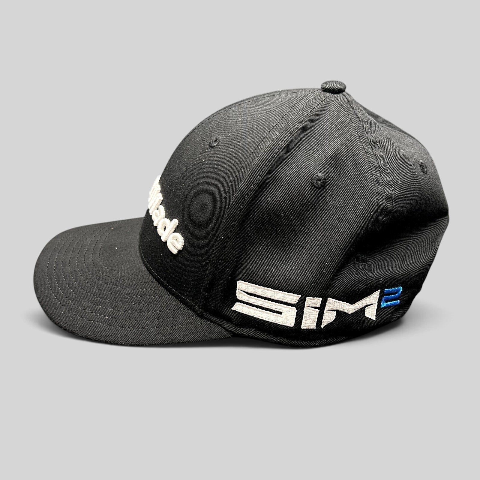 Raree Finds black TaylorMade golf snapback hat with white front embroidery and side SIM2 branding