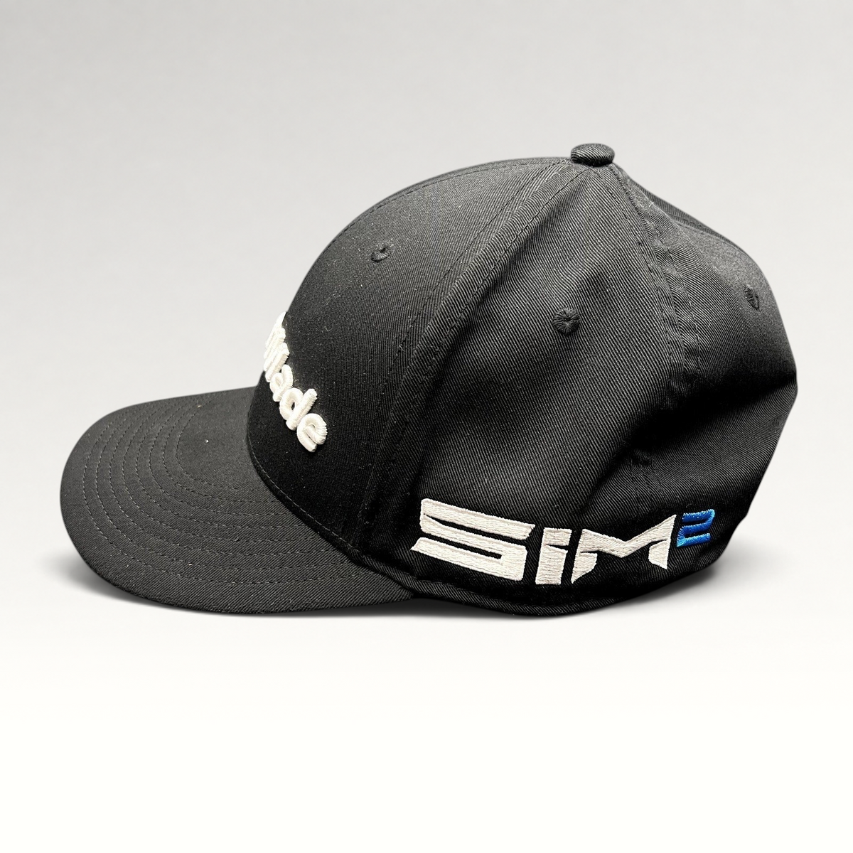 Raree Finds black TaylorMade golf snapback hat with white front embroidery and side SIM2 branding