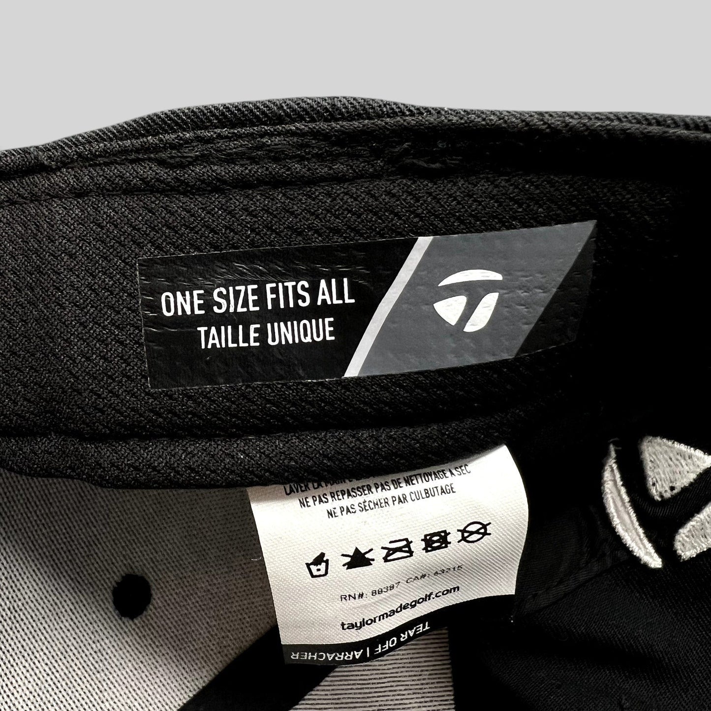 Raree Finds TaylorMade golf hat interior label showing one size fits all sizing and care instructions