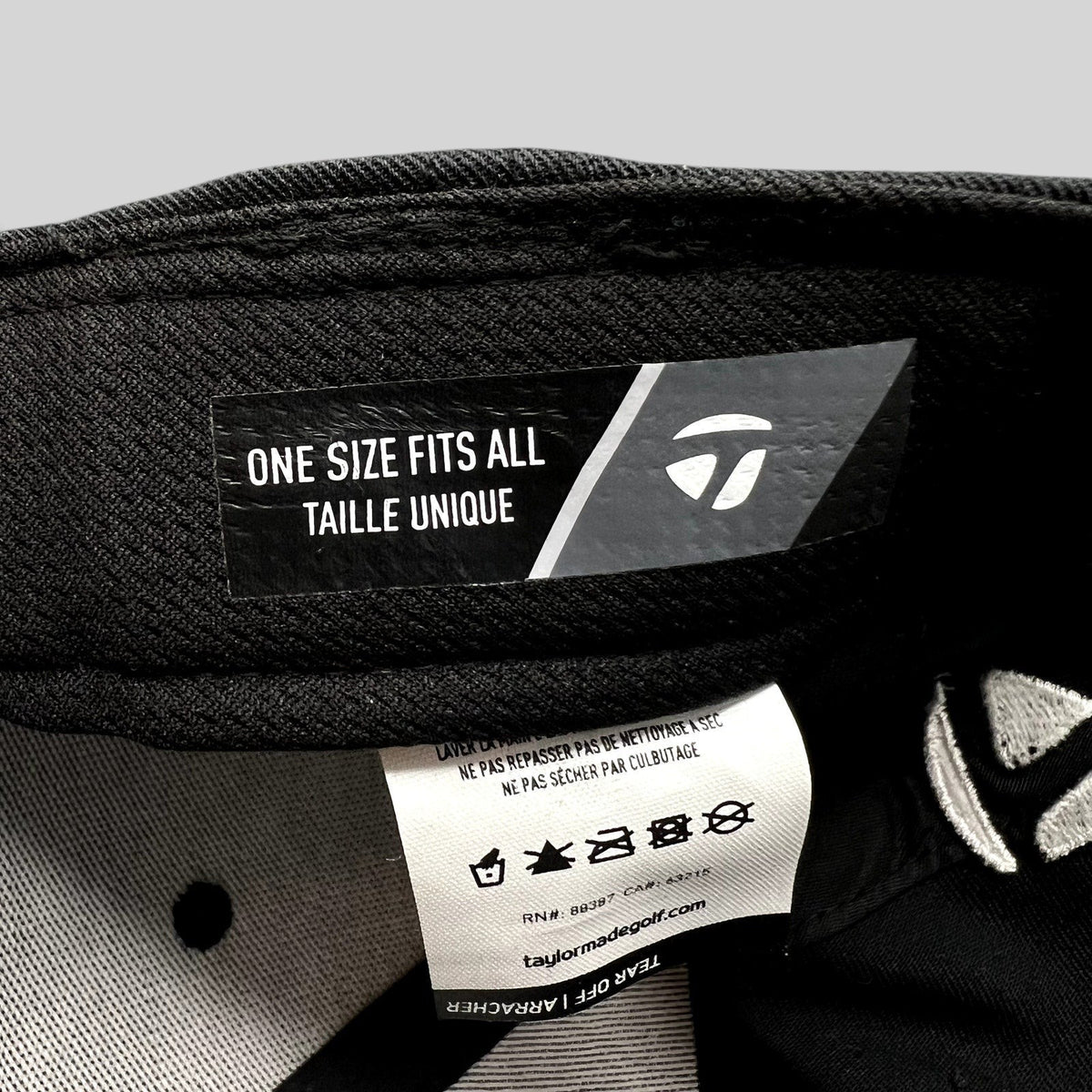 Raree Finds TaylorMade golf hat interior label showing one size fits all sizing and care instructions