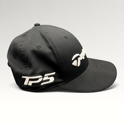 Raree Finds black TaylorMade TP5 golf snapback hat with raised white embroidery on the front and side panels.
