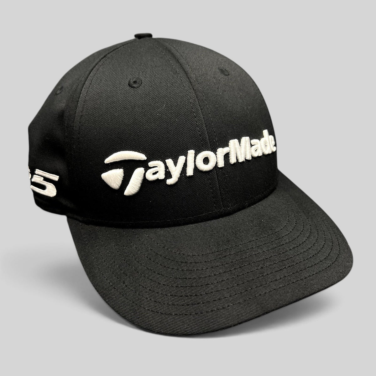 Raree Finds black TaylorMade TP5 golf snapback hat with raised white front embroidery and side branding