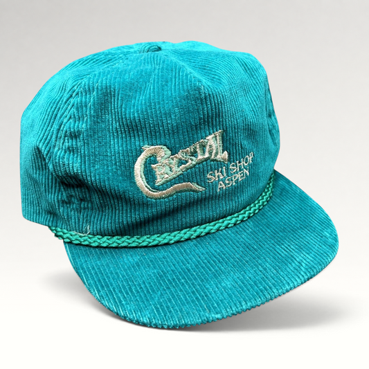 Raree Finds vintage teal corduroy strapback hat with Crystal Ski Shop Aspen embroidery and braided brim rope detail.