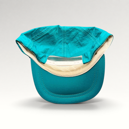 Raree Finds vintage 1992 Aspen Air Show teal nylon snapback hat showing the interior mesh and adjustable plastic strap