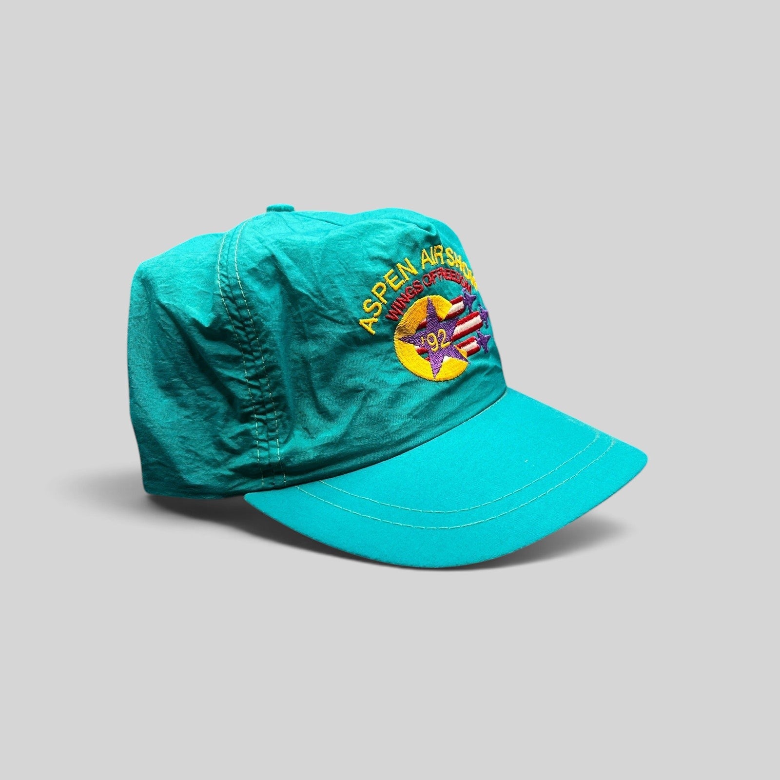Raree Finds vintage 1992 Aspen Air Show teal nylon snapback hat with Wings of Freedom embroidered graphic