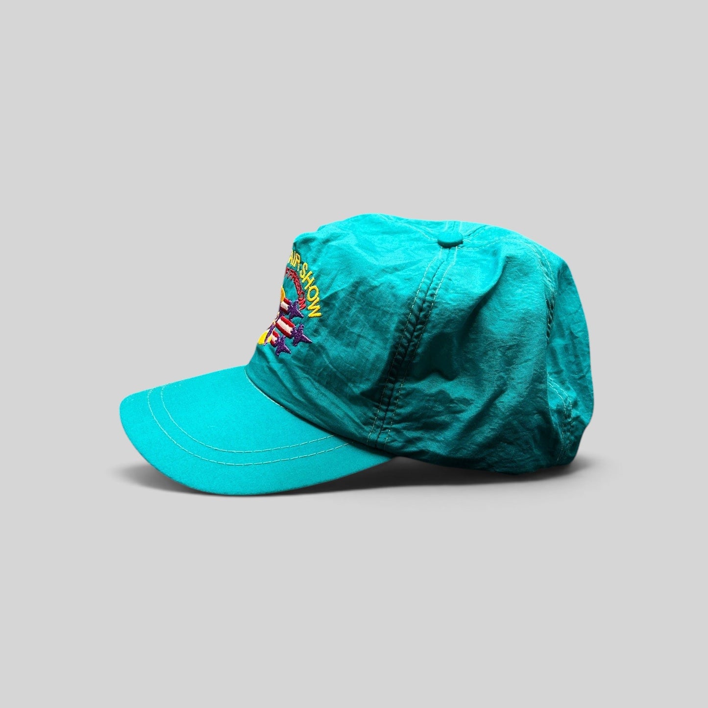 Raree Finds vintage 1992 Aspen Air Show teal nylon snapback hat with multicolor Wings of Freedom embroidery