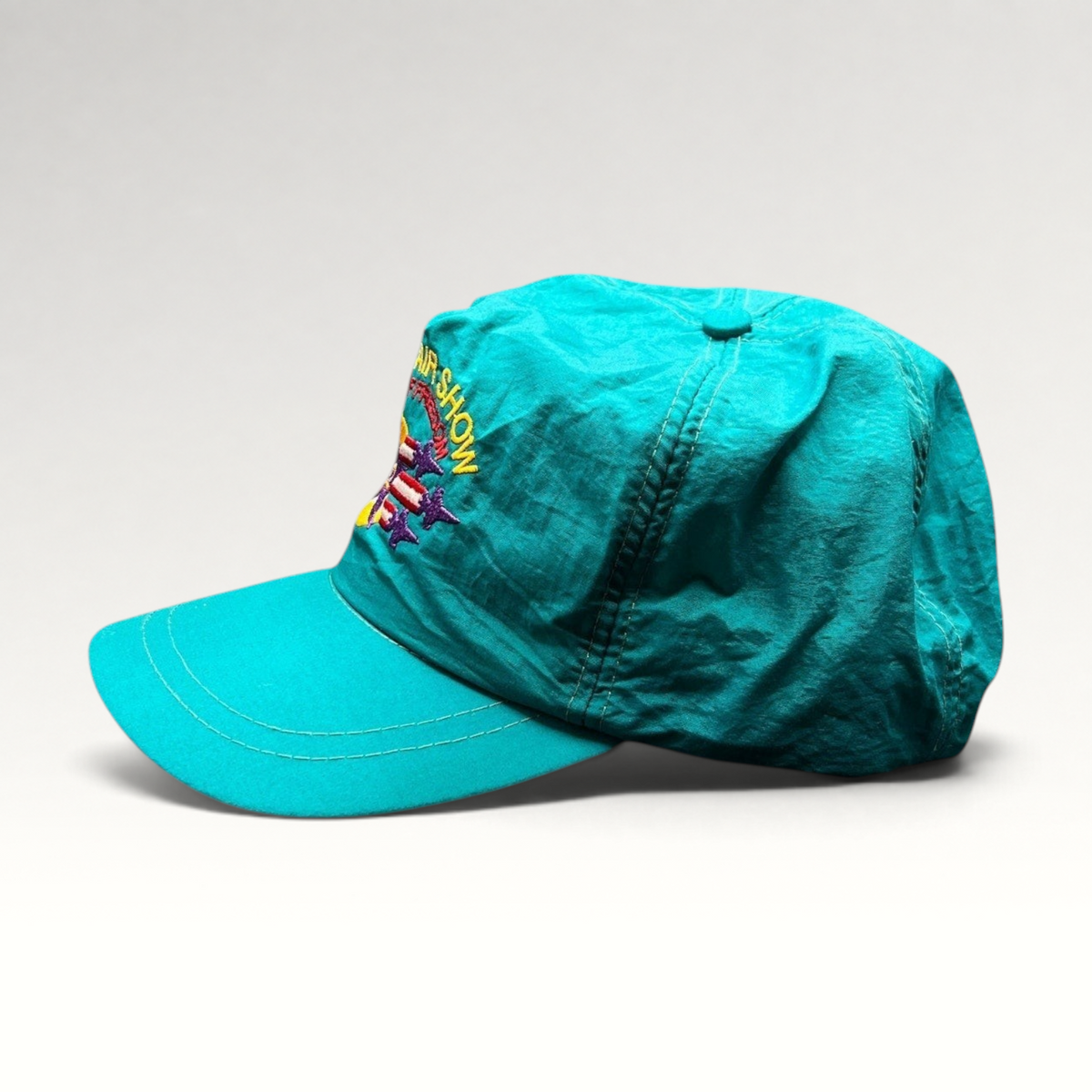 Raree Finds vintage 1992 Aspen Air Show teal nylon snapback hat with multicolor Wings of Freedom embroidery