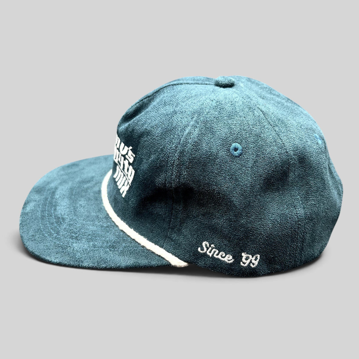 Raree Finds Calidum Aires teal suede snapback hat with white rope detail and Tommy’s Margarita Mix embroidery