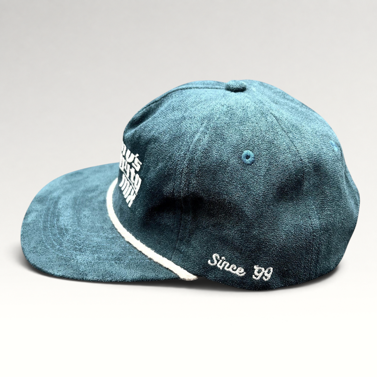 Raree Finds Calidum Aires teal suede snapback hat with white rope detail and Tommy’s Margarita Mix embroidery