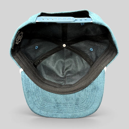 Raree Finds Calidum Aires teal suede snapback hat interior view showing black mesh lining and adjustable closure