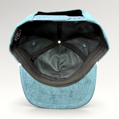 Raree Finds Calidum Aires teal suede snapback hat interior view showing black mesh lining and adjustable closure