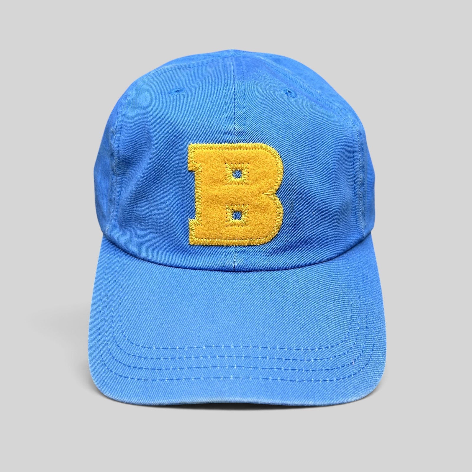 Raree Finds Ted Baker royal blue cotton dad cap with a large yellow chenille B appliqué on the front