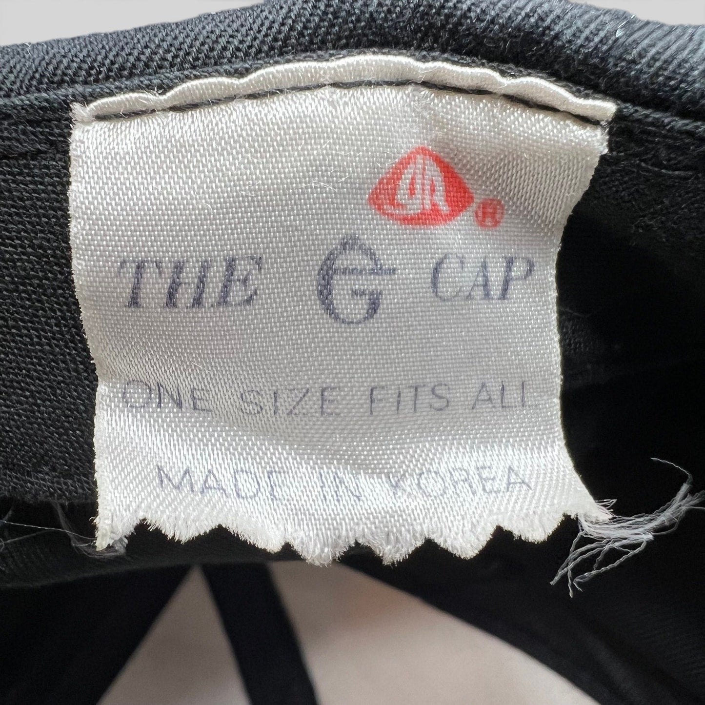 Raree Finds vintage The E Cap brand tag inside a 90s Chicago Bulls snapback hat, showing Made in Korea label.