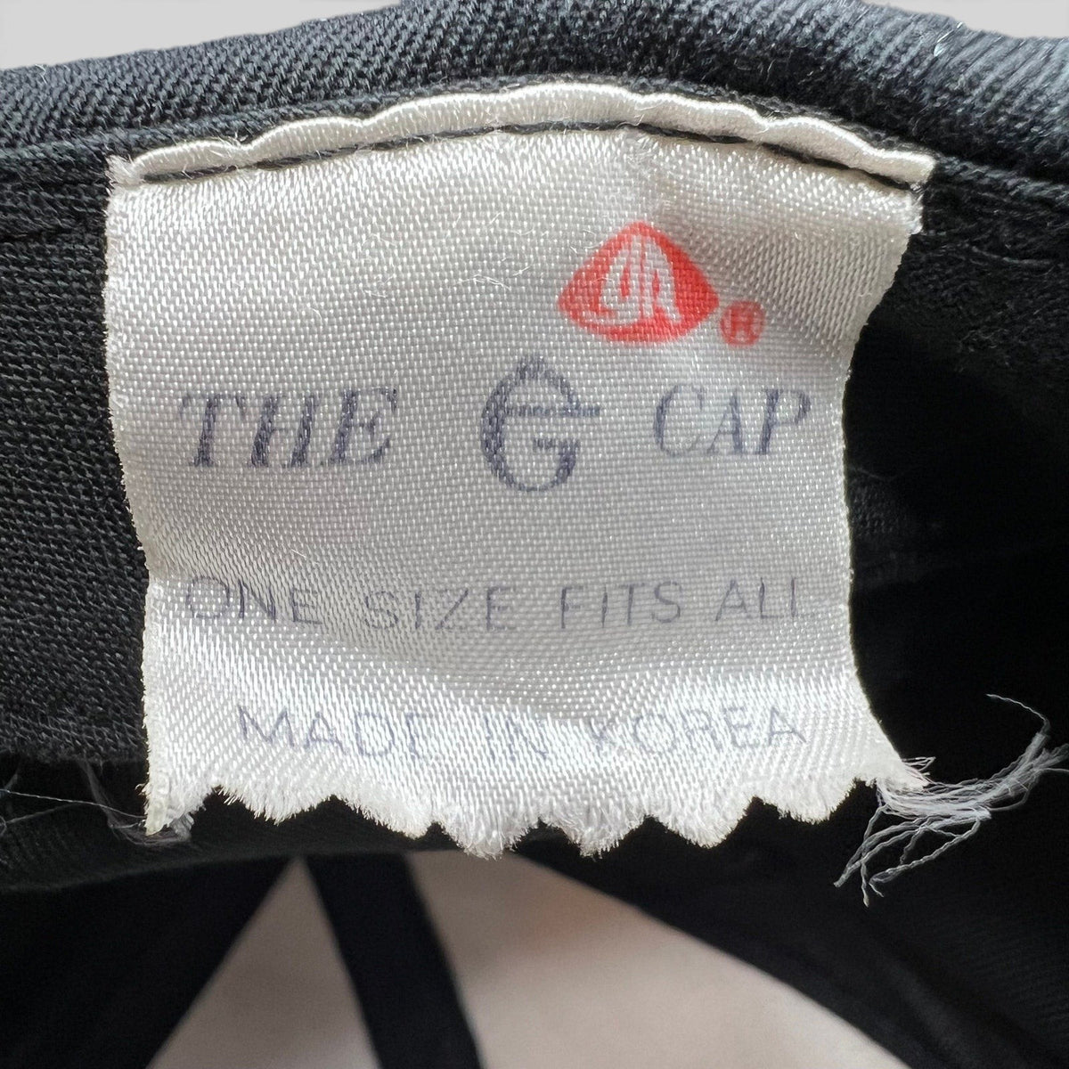 Raree Finds vintage The E Cap brand tag inside a 90s Chicago Bulls snapback hat, showing Made in Korea label.