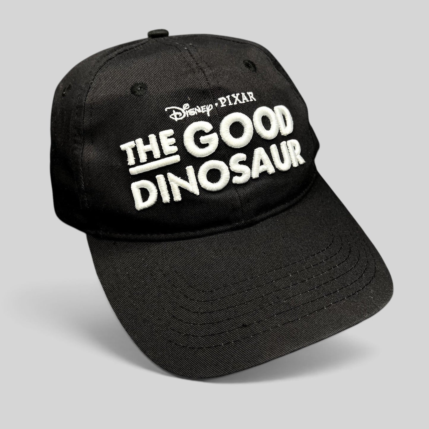 Raree Finds black Disney Pixar The Good Dinosaur strapback hat with white embroidered movie logo on front