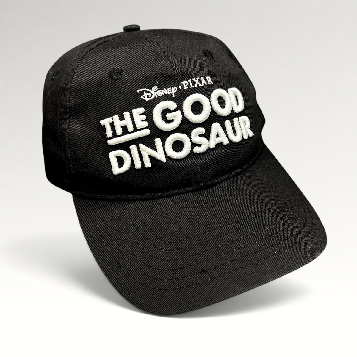 Raree Finds black Disney Pixar The Good Dinosaur strapback hat with white embroidered movie logo on front