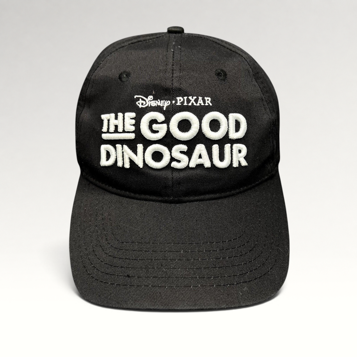 Raree Finds black Disney Pixar The Good Dinosaur promotional strapback hat with white embroidered front logo