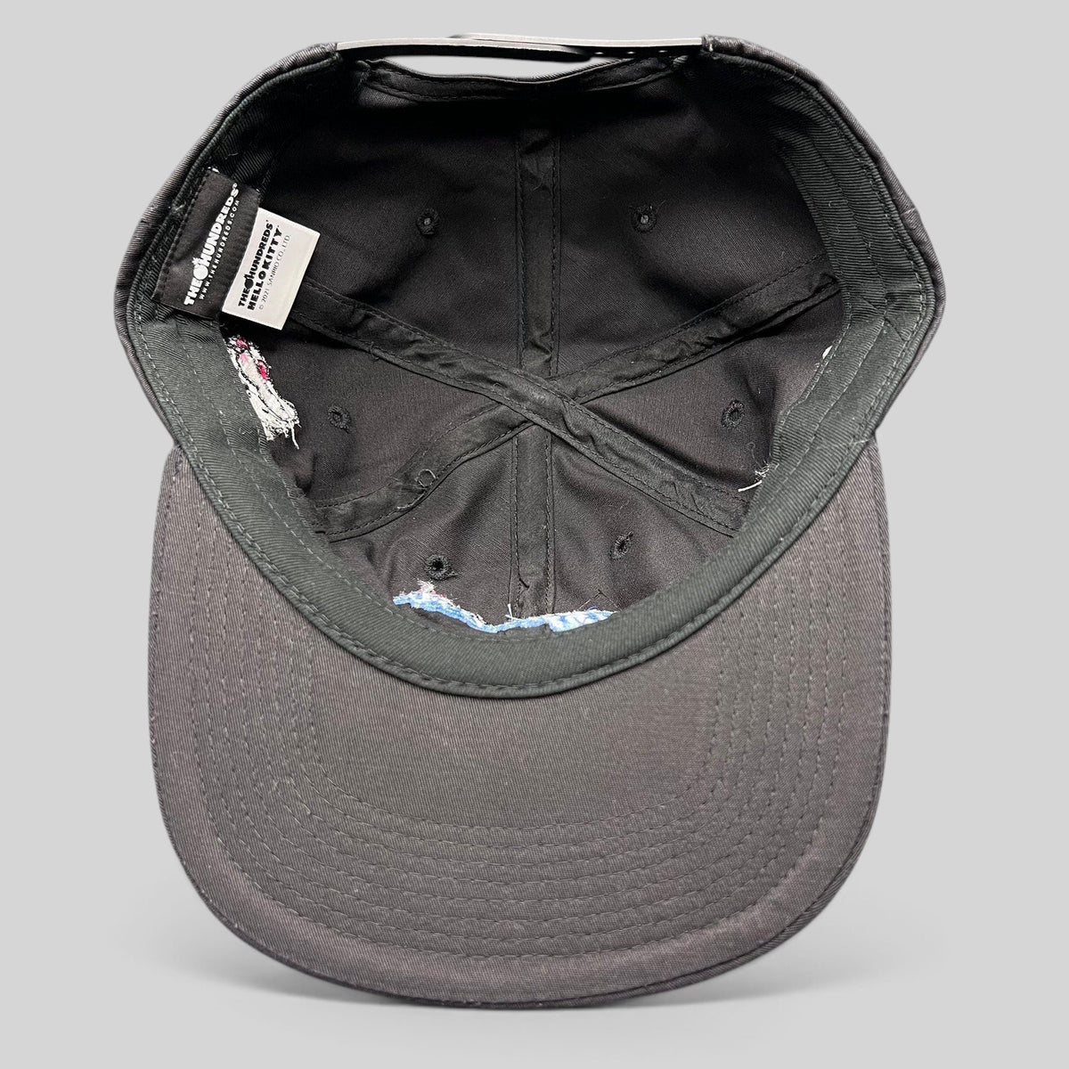 Raree Finds The Hundreds x Hello Kitty black cotton snapback hat interior view showing collaboration branding tags